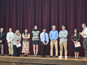 Students on stage participating in the Youth in Government Platform Convention.