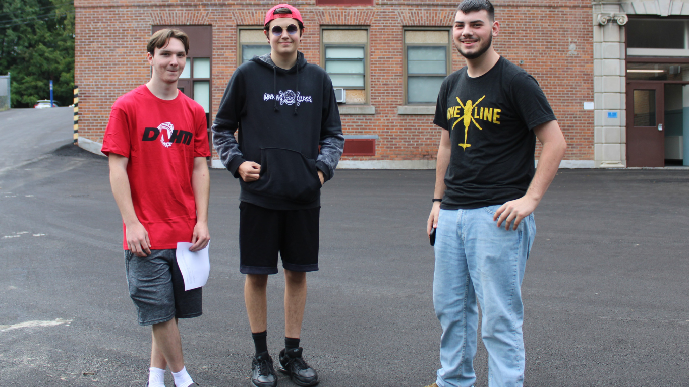 Three boys standing together outside ALC at Maybrook.