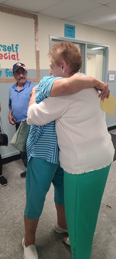 Two Maybrook School alumna Hug at the August 2024 reunion.