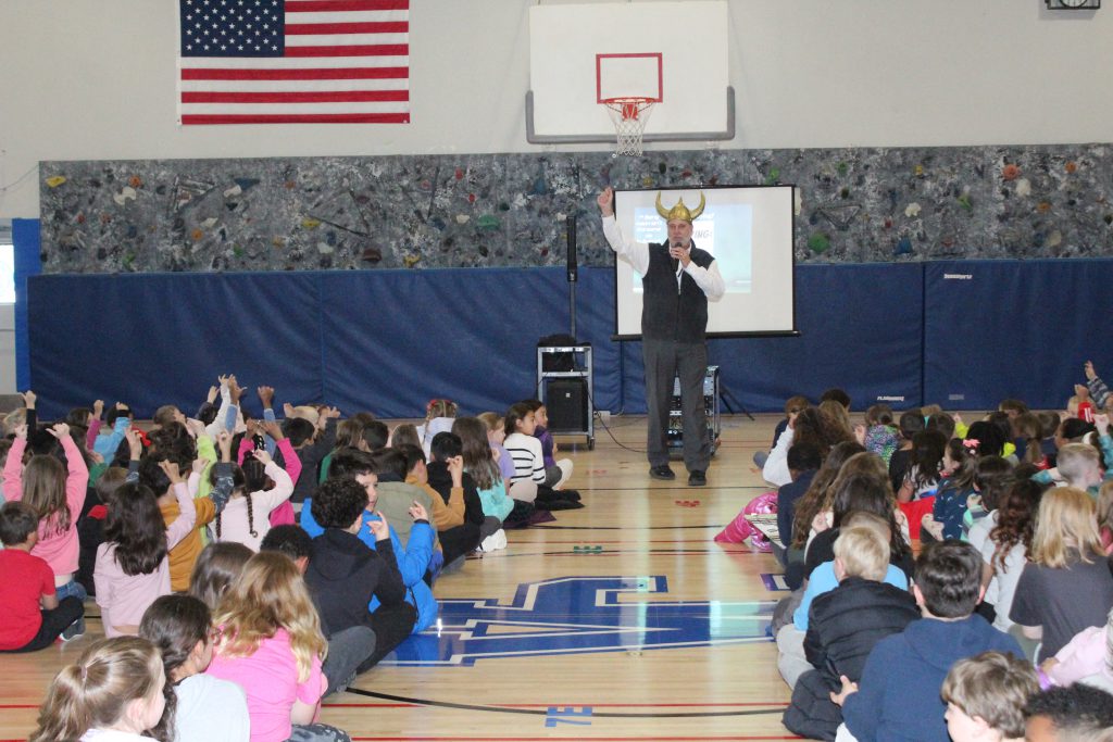 Students gather at a monthly PBIS assembly at Walden Elementary School led by Walden Elementary School principal Gregory Heidemann.